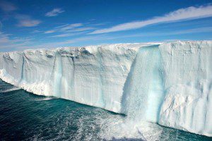 A waterfall cascades to the sea.